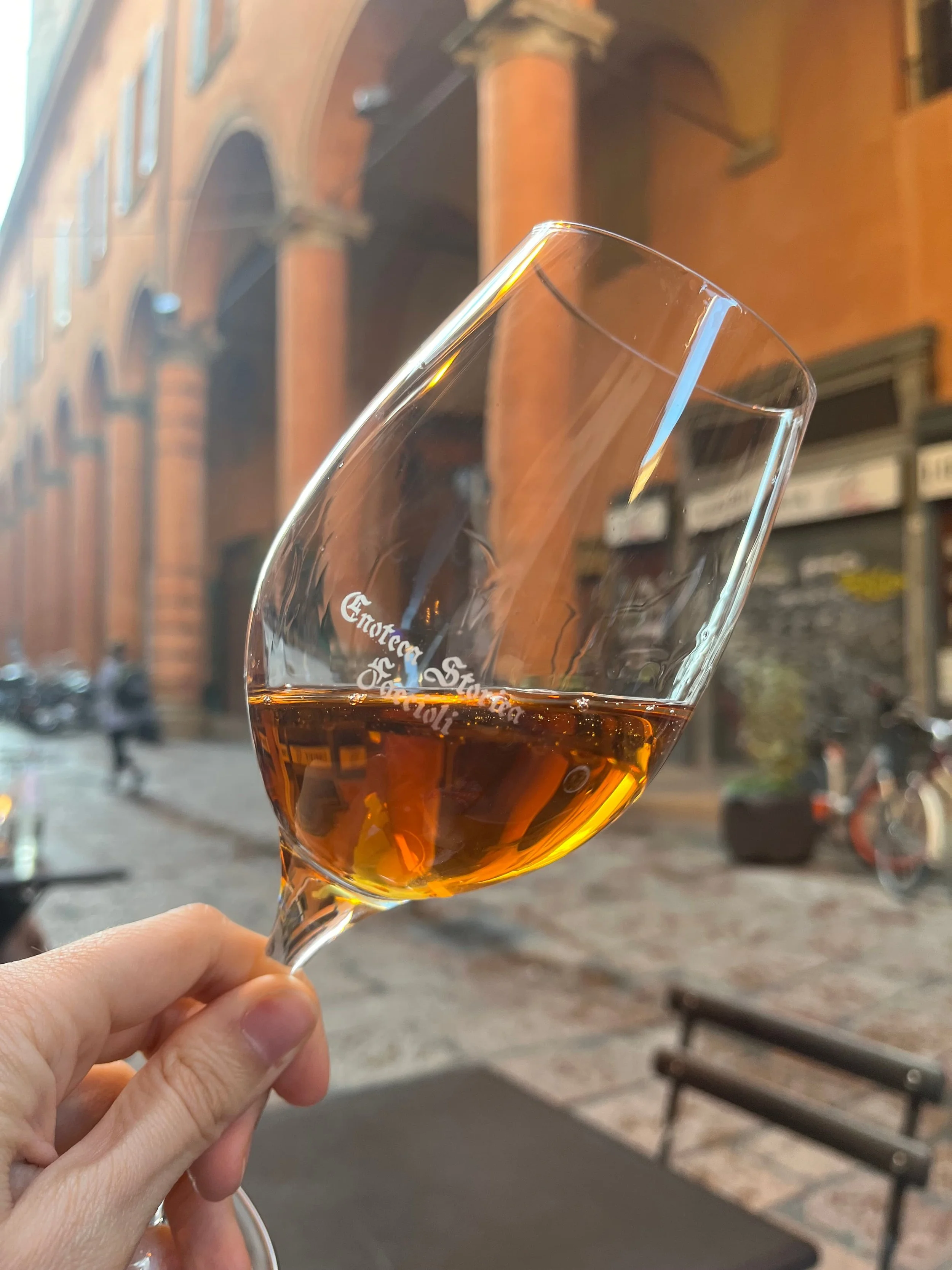 A glass of orange wine from Enoteca Storica.
