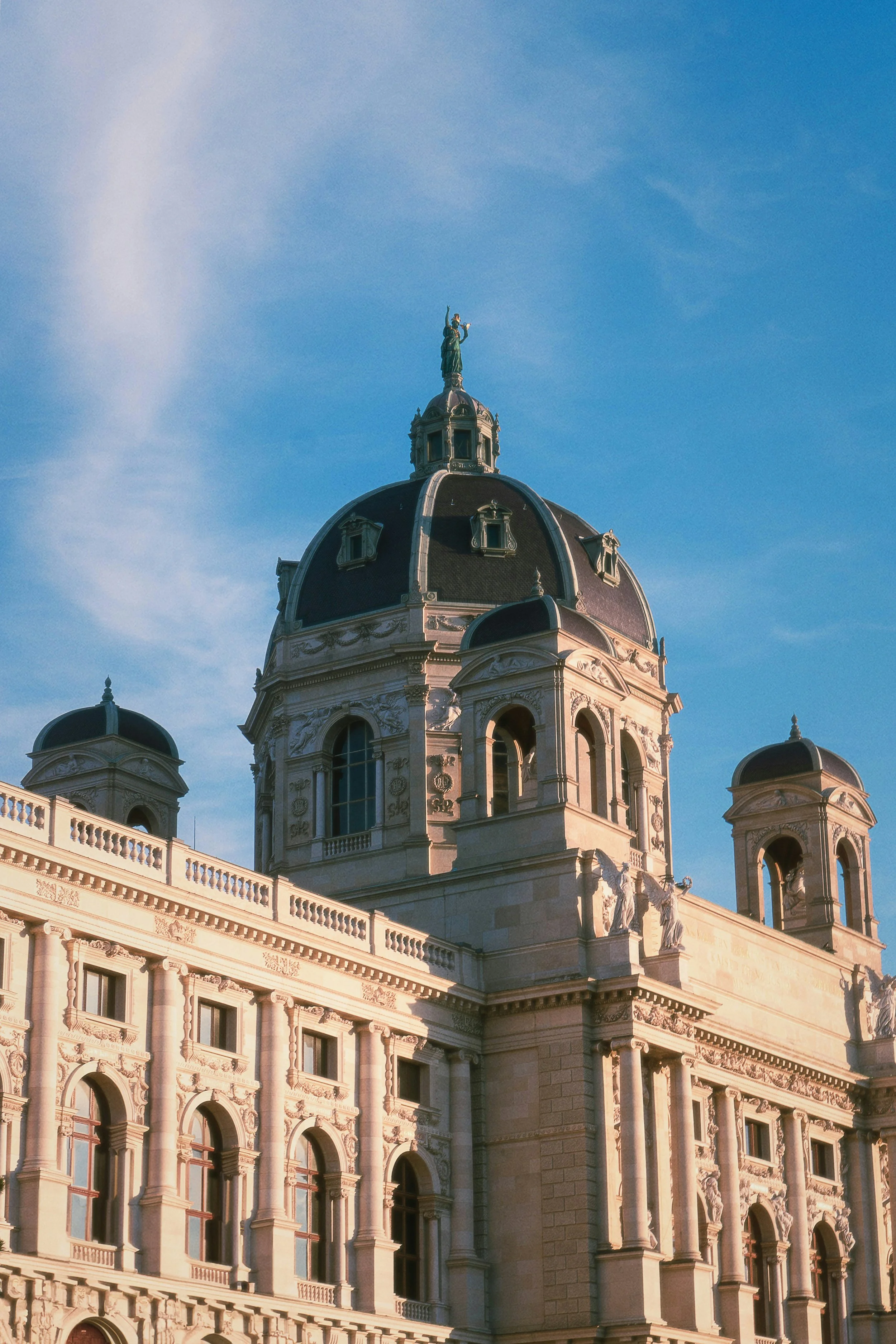The dome of the Kunsthistoriches Museum on a sunny day in Vienna, Austria.