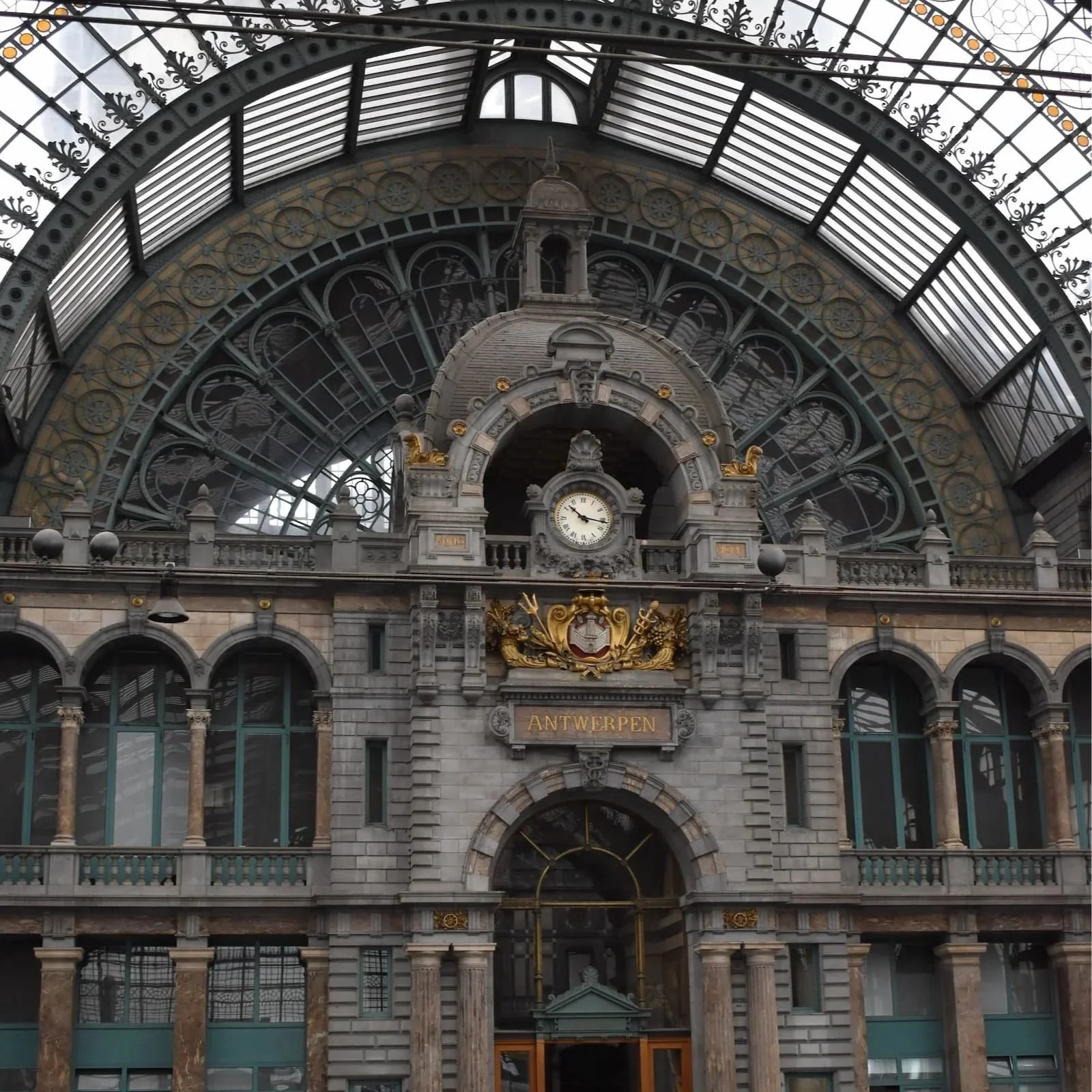 Admiring the glass and stone interior of Antwerpen Centraal Station is one of the best things to do in the city.