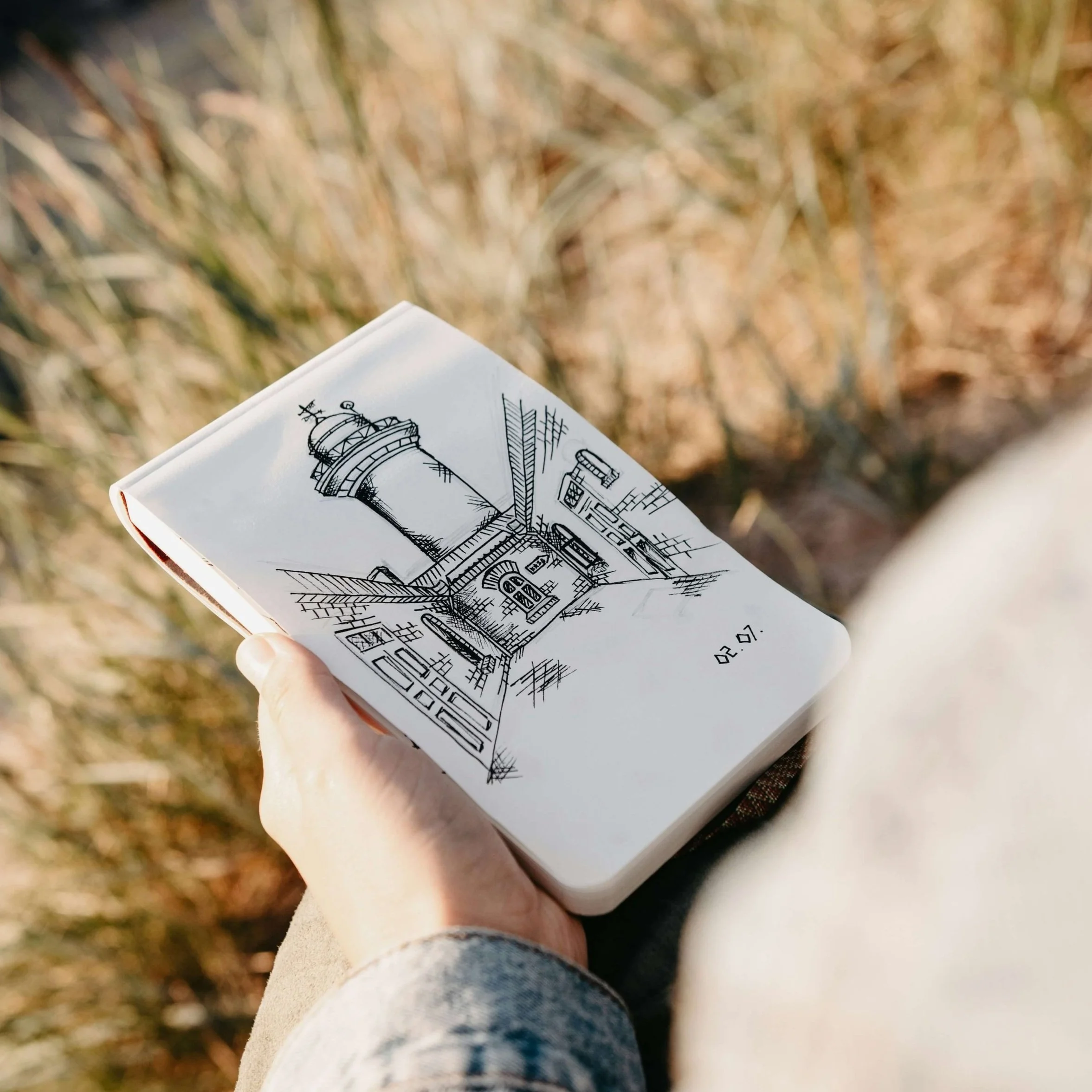 A pencil sketch in a notebook.
