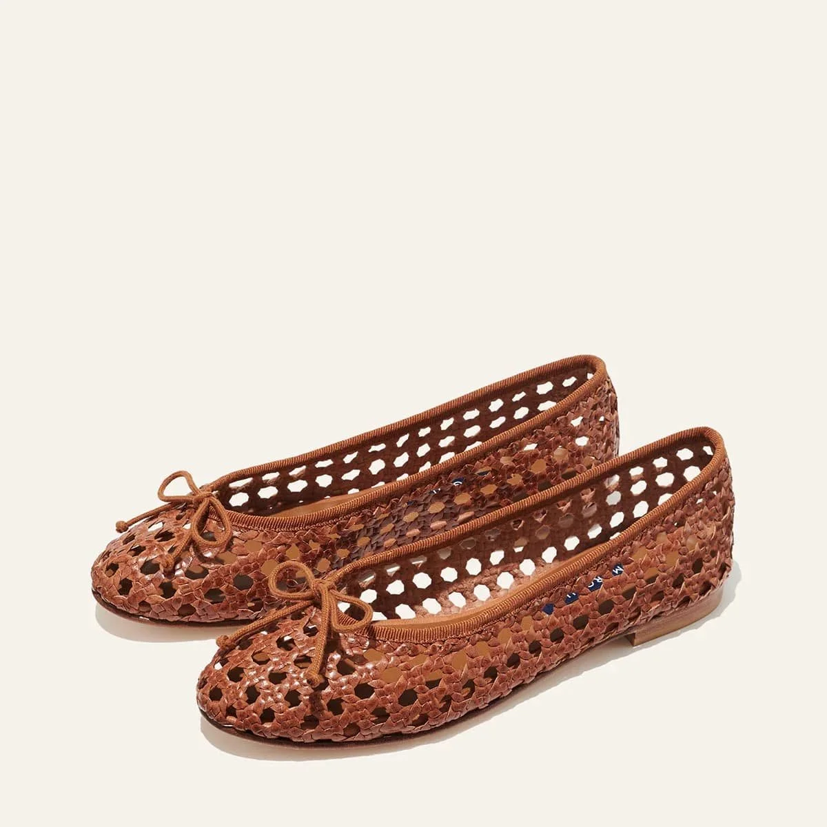 A leather woven pair of Margaux’s The Demi flats.
