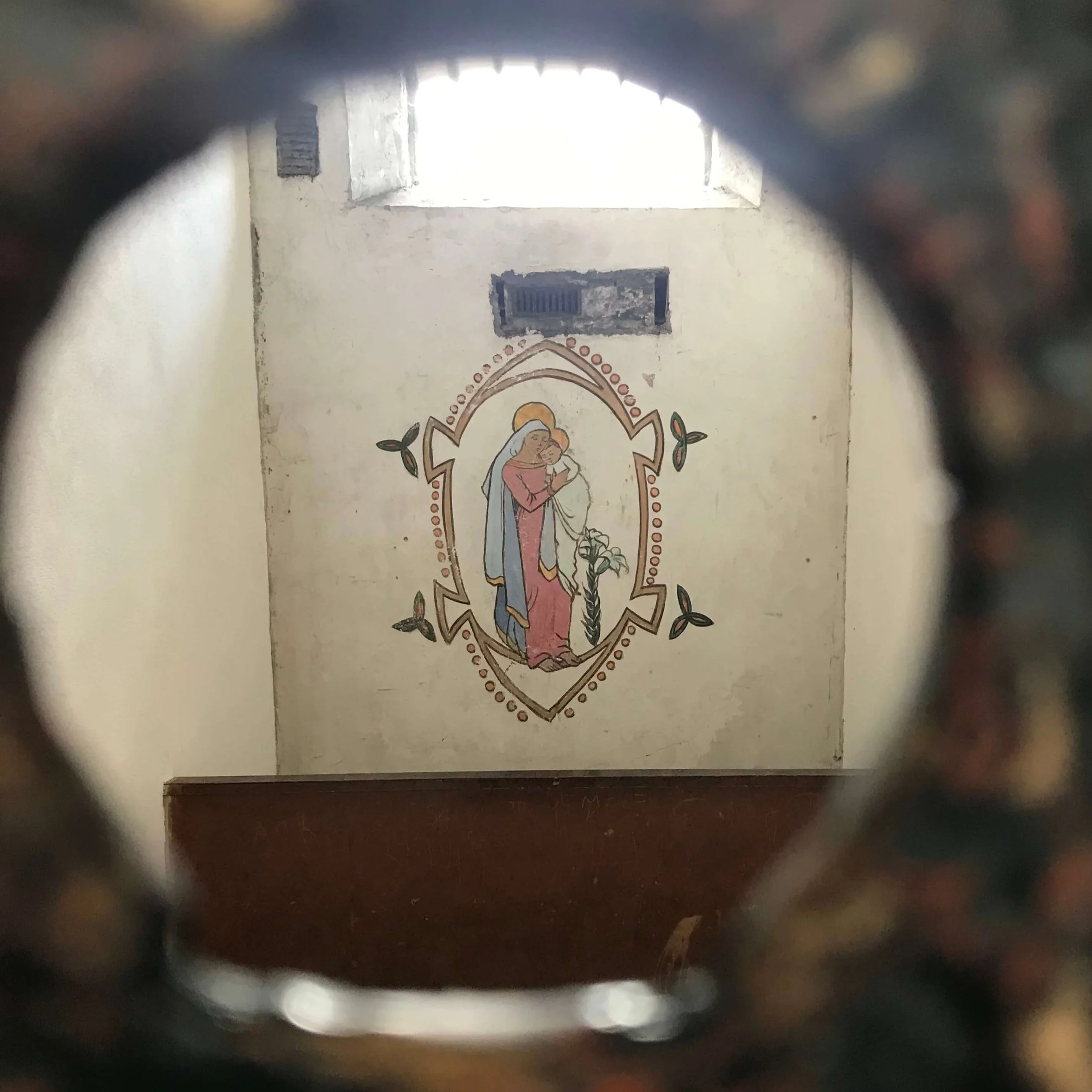 Grace Gifford's artwork of the Madonna and Child inside a cell at Kilmainham Gaol.