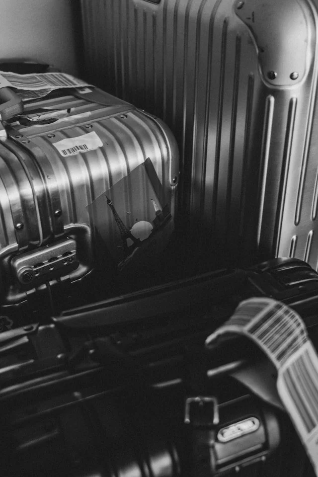 A trio of Rimowa suitcases.