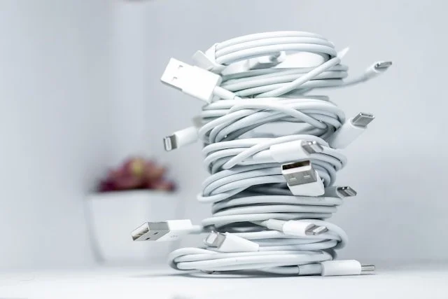 A stack of coiled iPhone chargers.