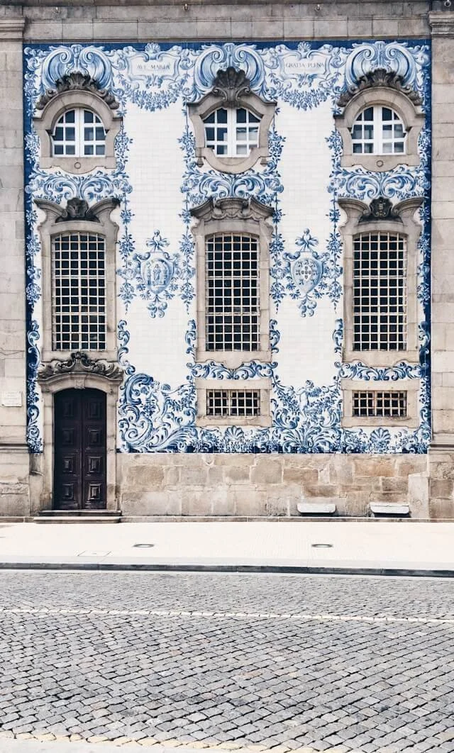 The blue and white tile exterior of Igreja do Carmo in Porto, Portugal.