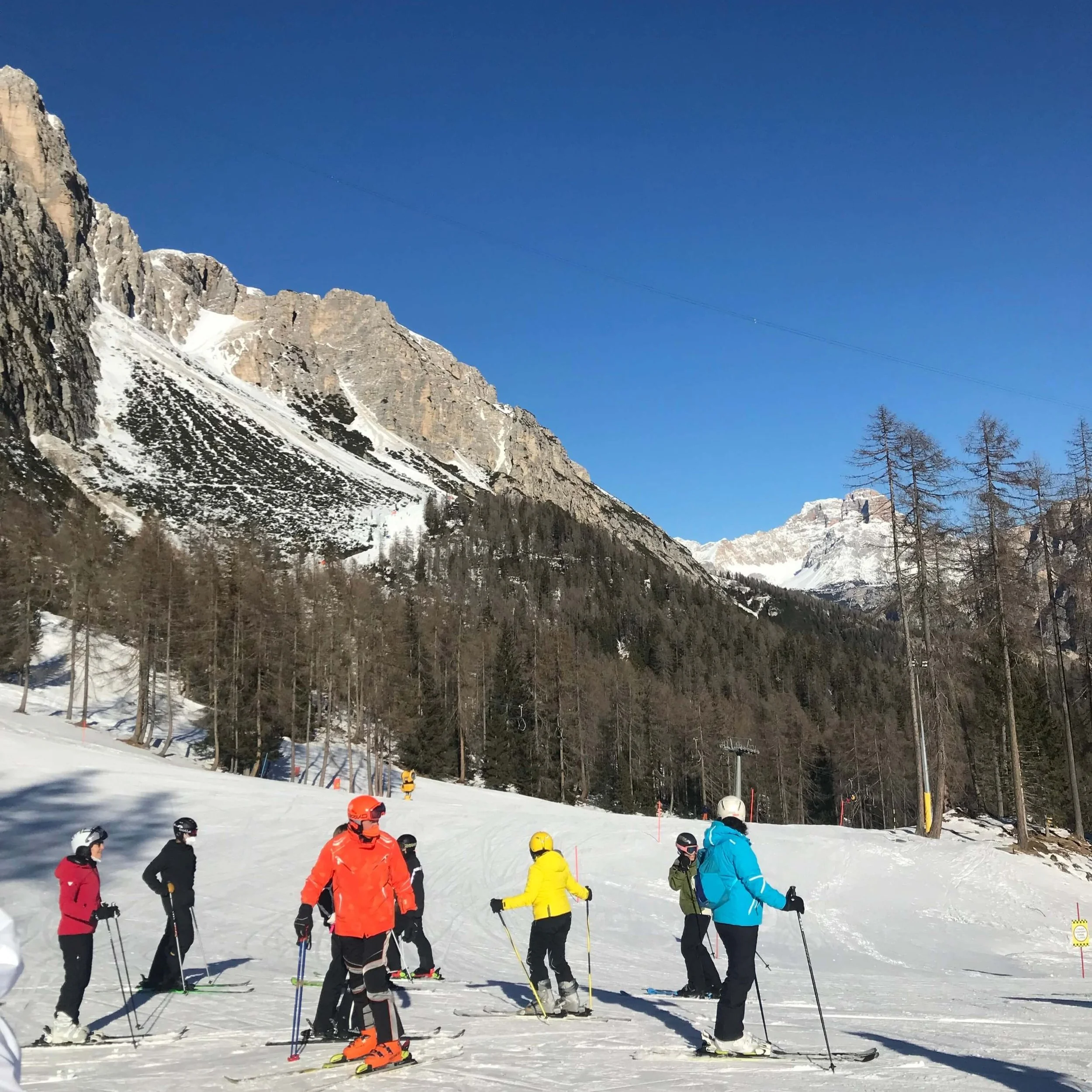 Skiers at the bottom of Tofana.